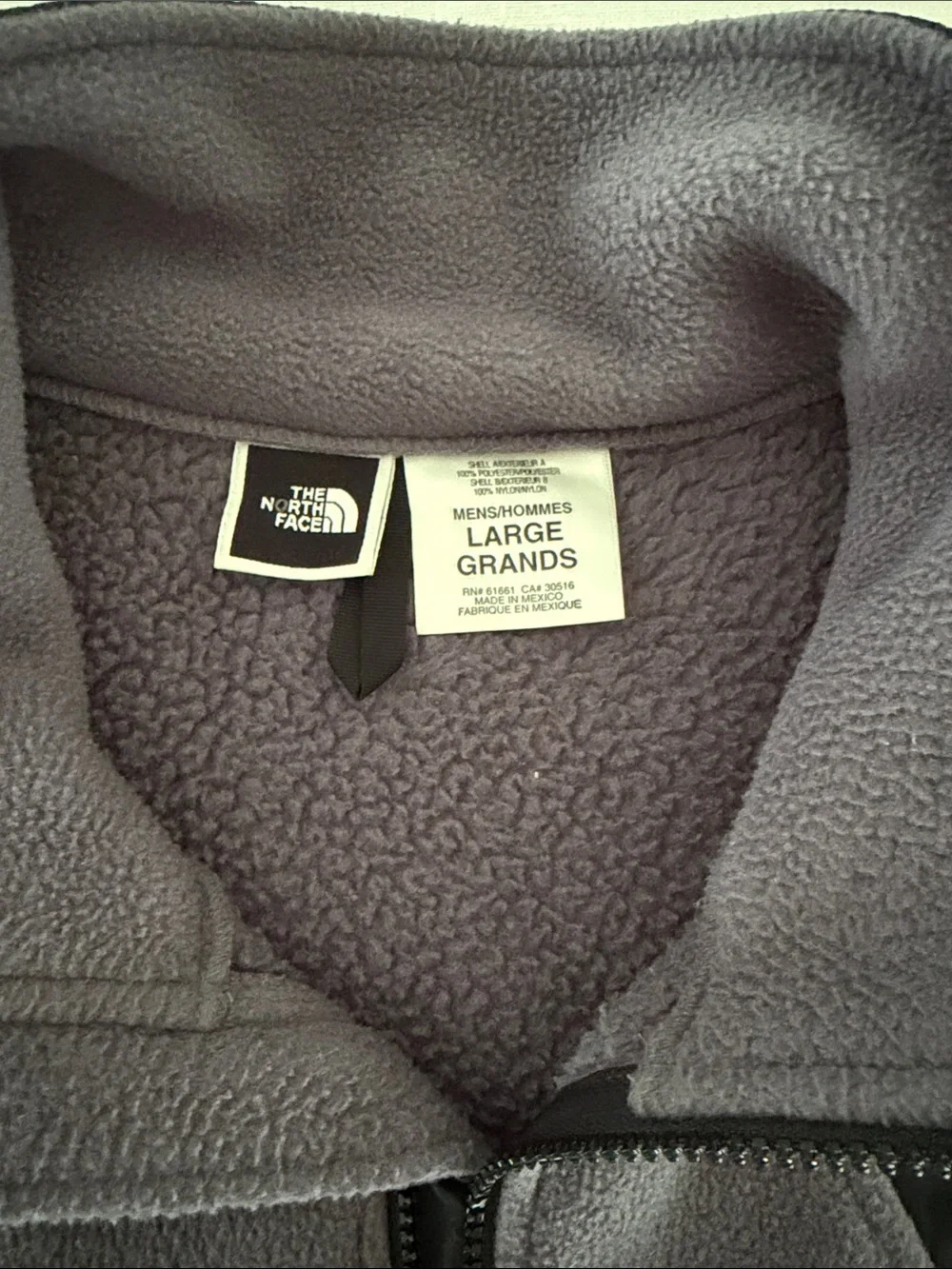 The North Face Black Shell with Gray Fleece-Lined Men's Vest